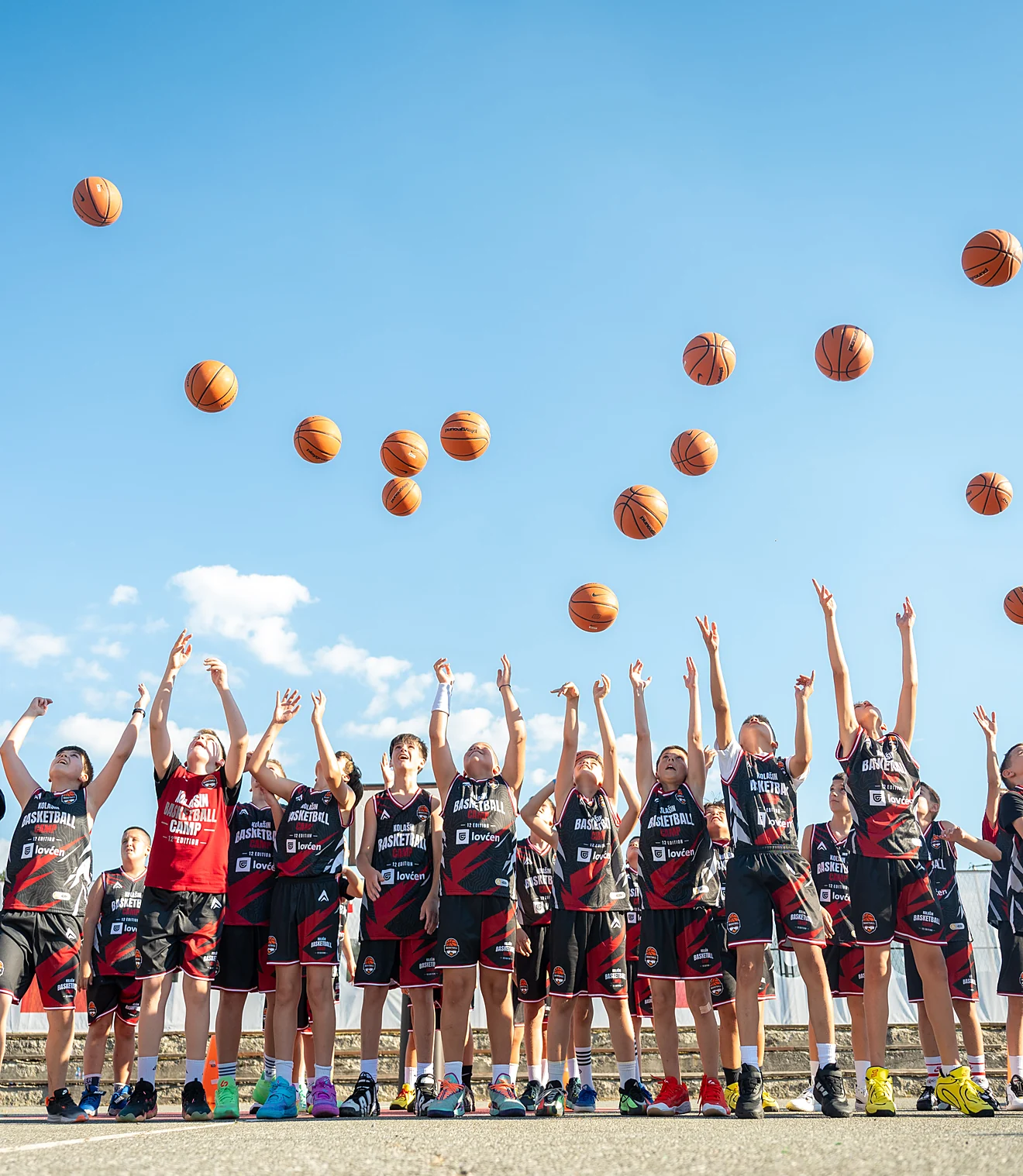 Campers launching basketballs into the sky